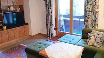 Comfort Apartment, 2 Bedrooms, Balcony, Mountain View | Living area | 50-inch flat-screen TV with cable channels