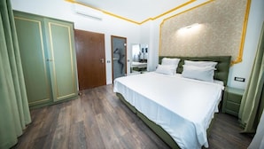 A bedroom with a bed, a wardrobe, a mirror, and a nightstand. - Nobilis Boutique Foisor (Bucharest)