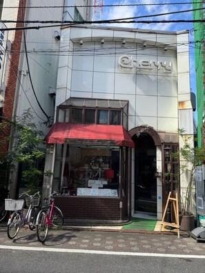 A building with a storefront featuring a red awning and a sign that reads 'Cherry.' - Newly Opened Right Next to JR Kamata Station: YU'S HOUSE 2 (大田区)