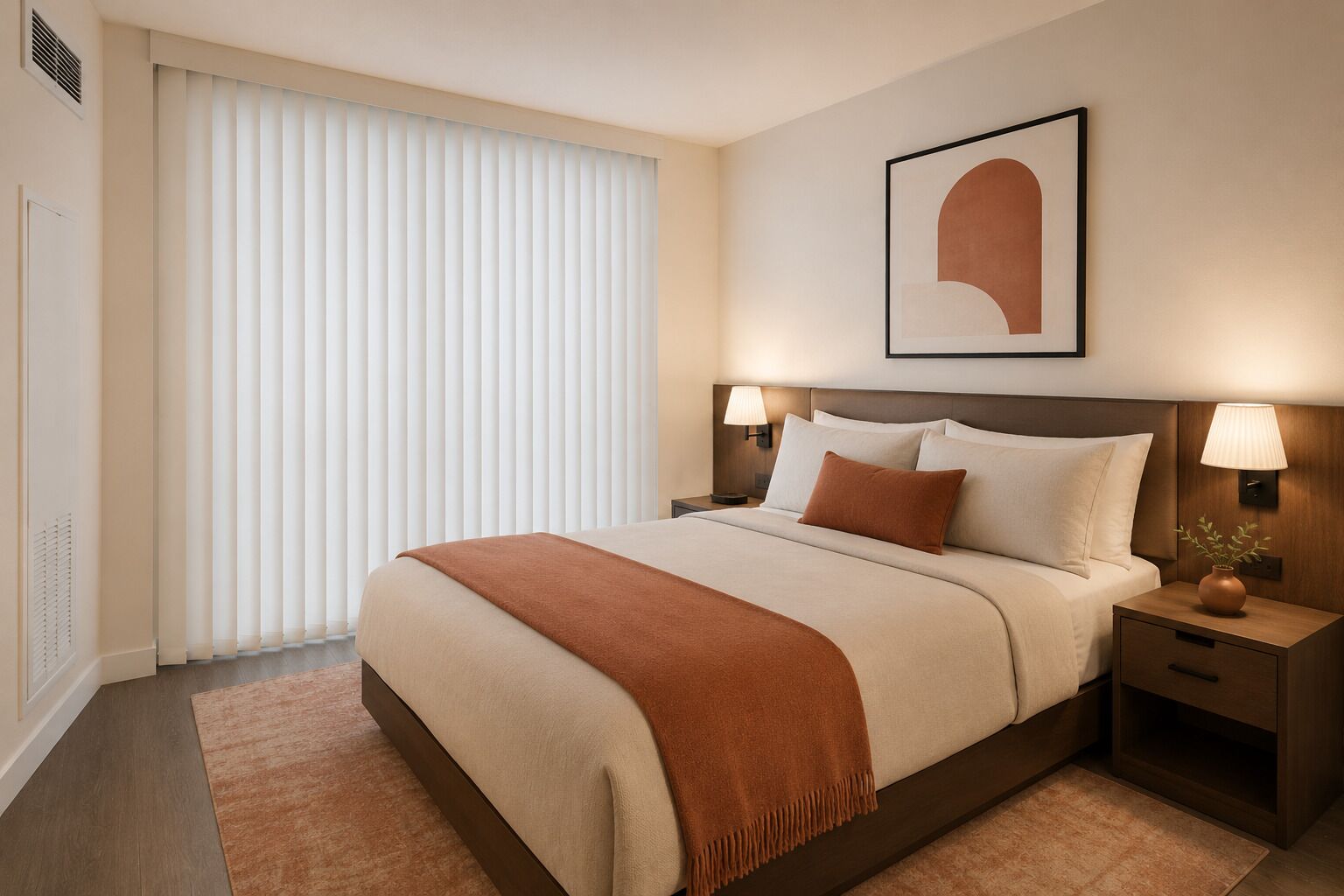A hotel room with a large bed, two bedside tables, a wall-mounted lamp, and a window with blinds.