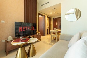 Deluxe Apartment, Balcony, Lake View | Living area | 130-cm Smart TV with satellite channels - Keyrock Living | Stylish Lakeview in Business Bay (Dubai)
