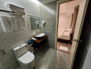 A modern bathroom with a toilet, sink, and shower area. - HAKU Boutique Hotel Da Lat - Ly Tu Trong (Da Lat)