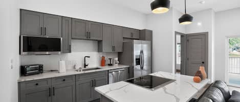 Coffee/tea maker, fridge, microwave, oven