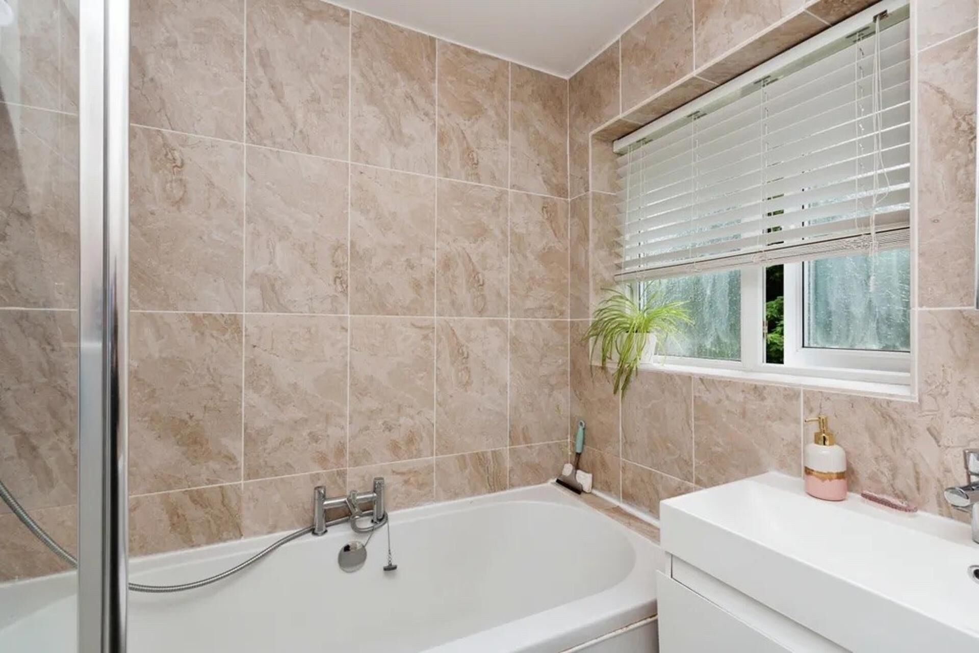Combined shower/bathtub, deep-soaking bathtub, hair dryer, towels