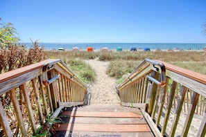 A wooden pathway leading to beach chairs. - Ocean View 1BR Suite + Beach Access + Lazy River (Myrtle Beach)
