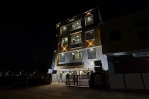 A multi-story building with balconies and a gated entrance. - Townhouse Oak Iskcon Jaipur Formerly Olive Greens (Jaipur)