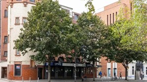 A building with a theater entrance, trees, and a street. - The Shepherd Bush Stay in London by Gndj (London)