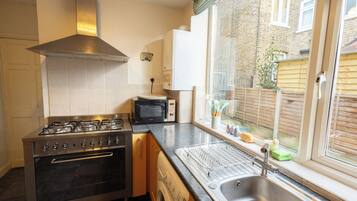 Coffee/tea maker, fridge, microwave, oven