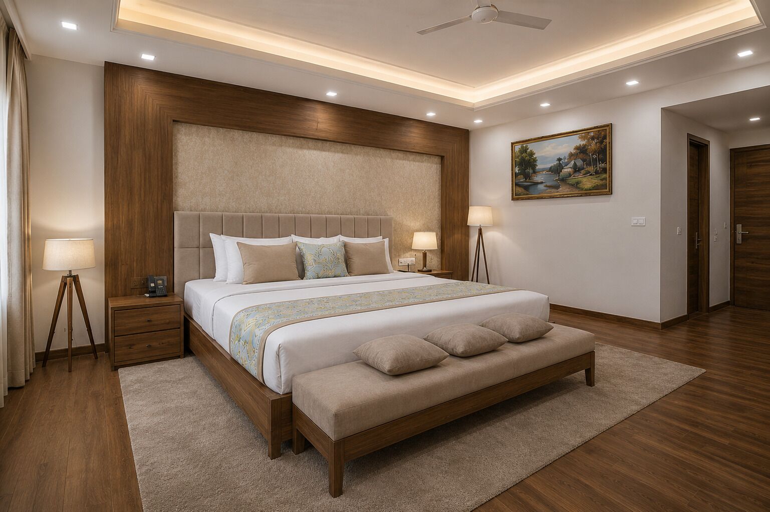 A modern bedroom with a large bed, bedside lamps, a bench, and a ceiling fan.