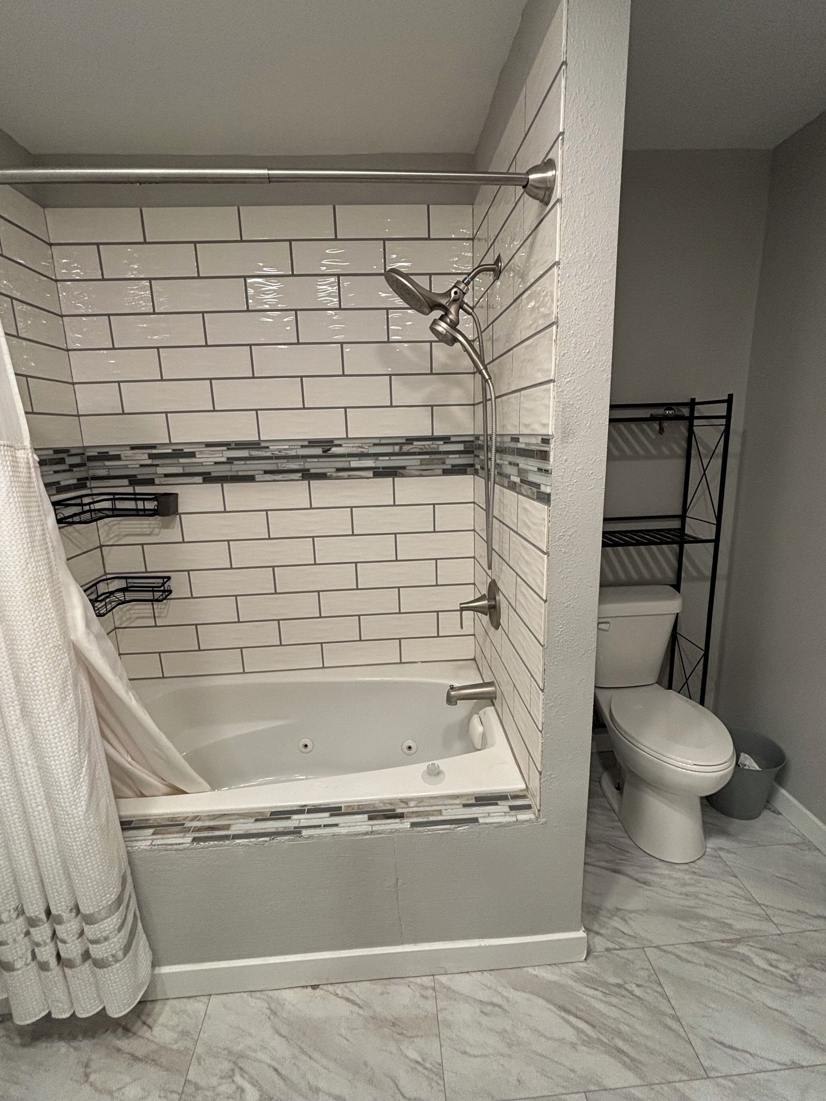 Jetted tub, hair dryer, towels, soap