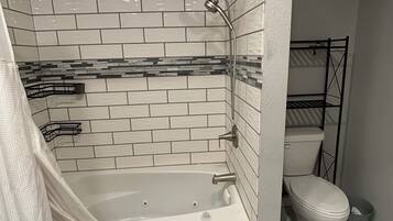 Jetted tub, hair dryer, towels, soap