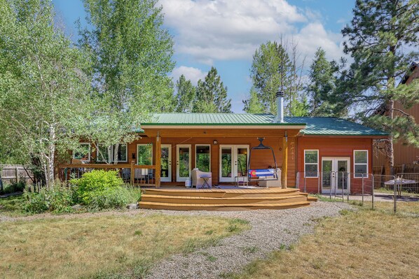 A wooden cabin with a porch, a covered patio, and a chimney. - Outdoor Oasis! Angler's Paradise in Pagosa Springs (Pagosa Springs)