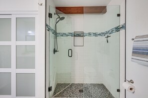 A glass-enclosed shower with a wooden ceiling, tiled walls, and a towel rack. - Outdoor Oasis! Angler's Paradise in Pagosa Springs (Pagosa Springs)