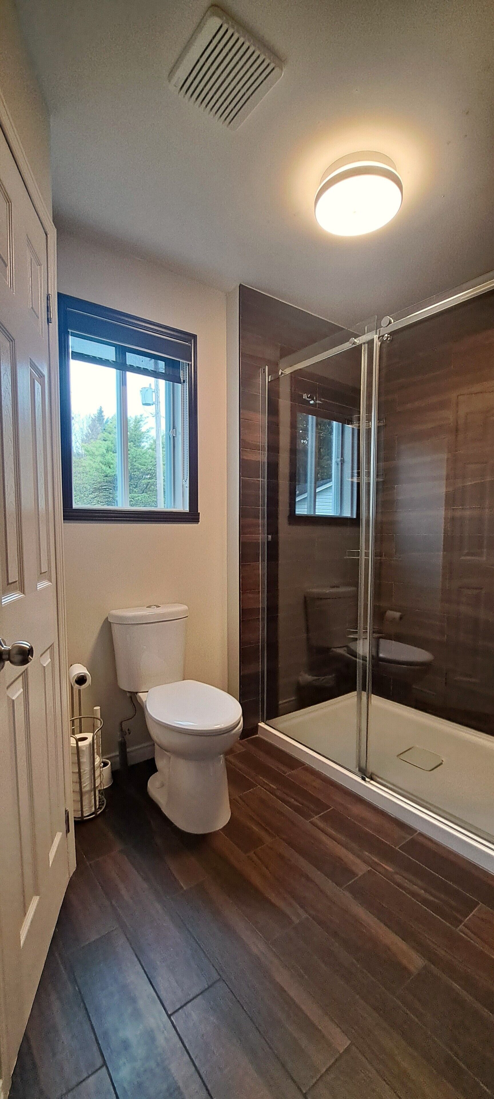 Shower, hair dryer, towels, toilet paper