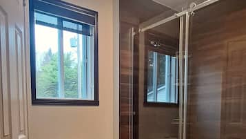 Shower, hair dryer, towels, toilet paper