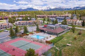 A residential area with a tennis court, pool, and mountain views. - The Colony Unit #102 Ground floor, renovated, private patio, near outdoor trails (Fraser)