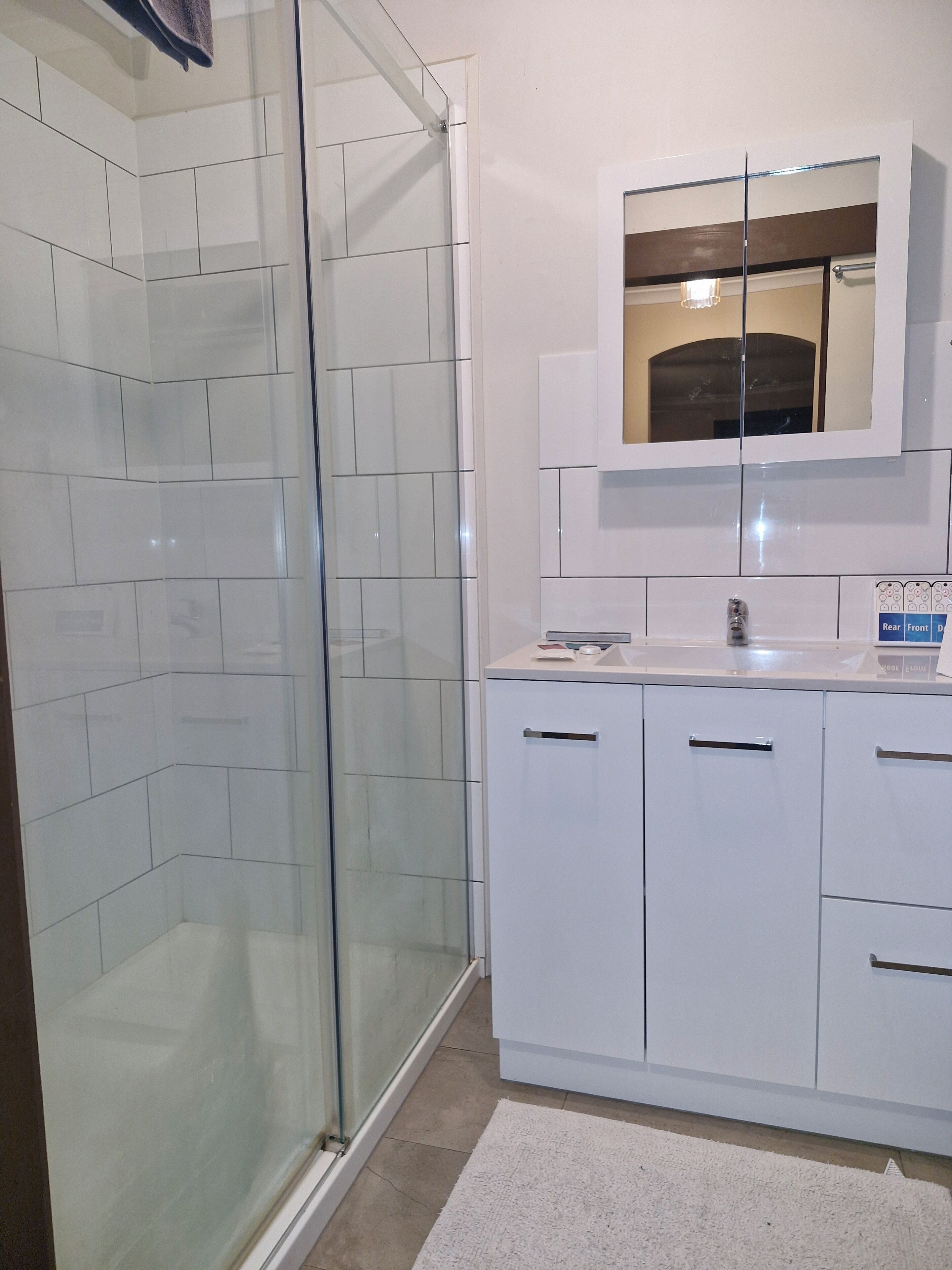 Shower, hair dryer, towels, toilet paper