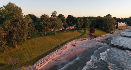 4BR Lakefront Getaway! Sunset Views, Private Community Beach, Cozy Back Porch