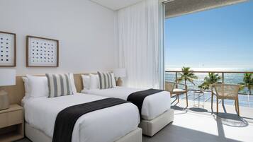 Deluxe Room, Balcony, Beach View | In-room safe, desk, iron/ironing board, free WiFi