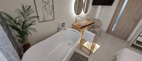 A modern bathroom with a freestanding bathtub, a wooden side table with a bowl, a chair, and a potted plant.