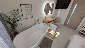 A modern bathroom with a freestanding bathtub, a wooden side table with a bowl, a chair, and a potted plant. - My Hersonissos Home - Luxury Suite (Hersonissos)