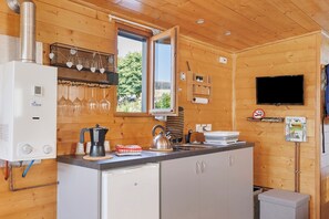 Fridge, microwave, stovetop, coffee/tea maker
