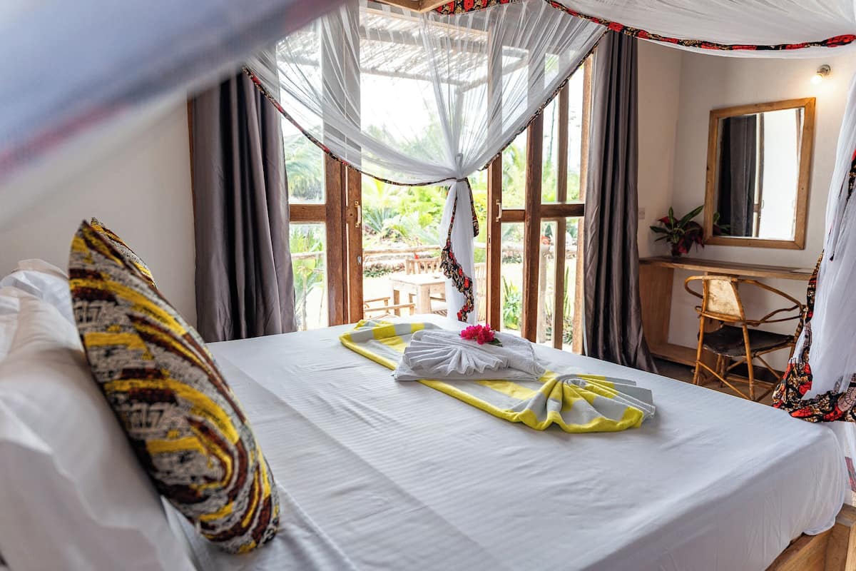 Deluxe Quadruple Room, Partial Ocean View | Free WiFi