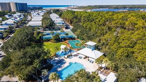 An aerial view of a resort with multiple tennis courts, a swimming pool, and a beachfront. - Spacious 2-Story Condo - The Bullpen at Carillon Beach  3BD/2.5BA 30A (Panama City Beach)