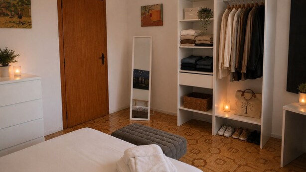 A bedroom with a bed, a wardrobe, a mirror, and a bedside table. - Aqua Home Area – Core Five (Porto Cesareo)