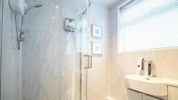 Shower, hair dryer, towels, soap