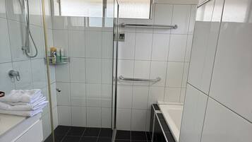 Shower, hair dryer, towels, soap