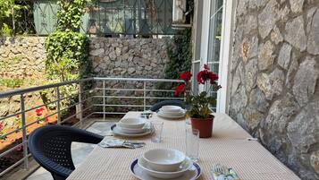 Classic Triple Room, Patio, Pool View | Outdoor dining
