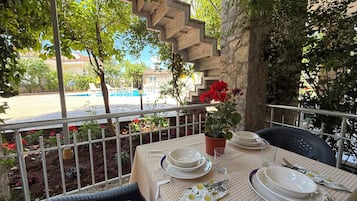 Family Quadruple Room, Balcony, Pool View | Outdoor dining