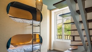 A bunk bed with a ladder, a hanging light fixture, and a staircase. - Luxury Duplex With Magnificent sea View (Landeda)