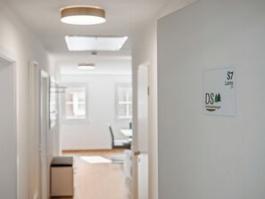 A hallway with a sign indicating 'S7 Laura DS Ferienwohnungen.' - Laura (S7) by Interhome (Endingen am Kaiserstuhl)