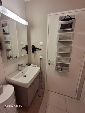 Hair dryer, towels, soap, toilet paper