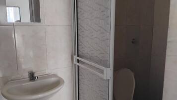 Shower, towels, soap, toilet paper