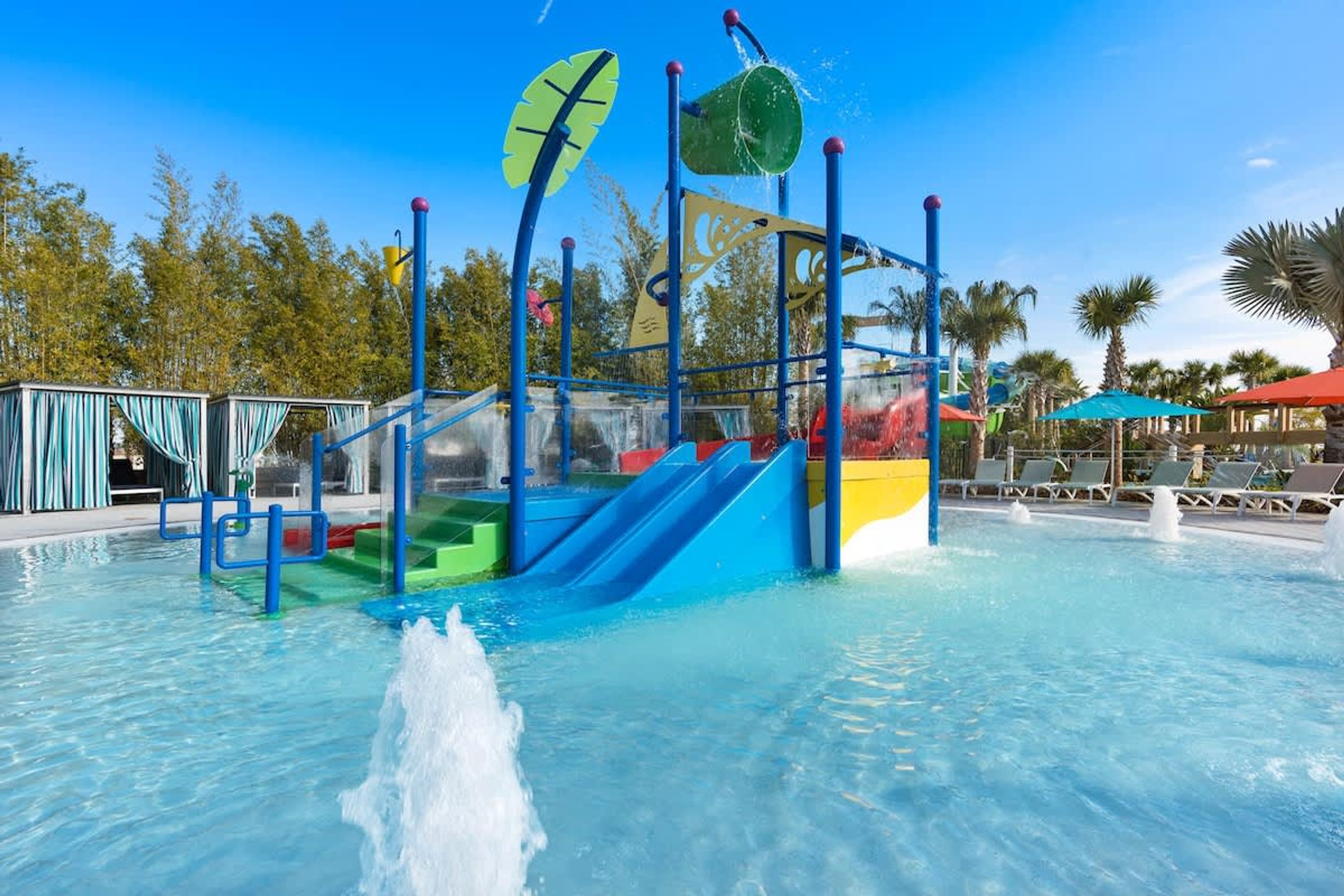 A water play area with slides and a water jet.