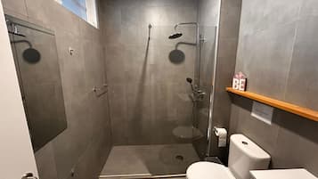 Shower, towels, soap, toilet paper