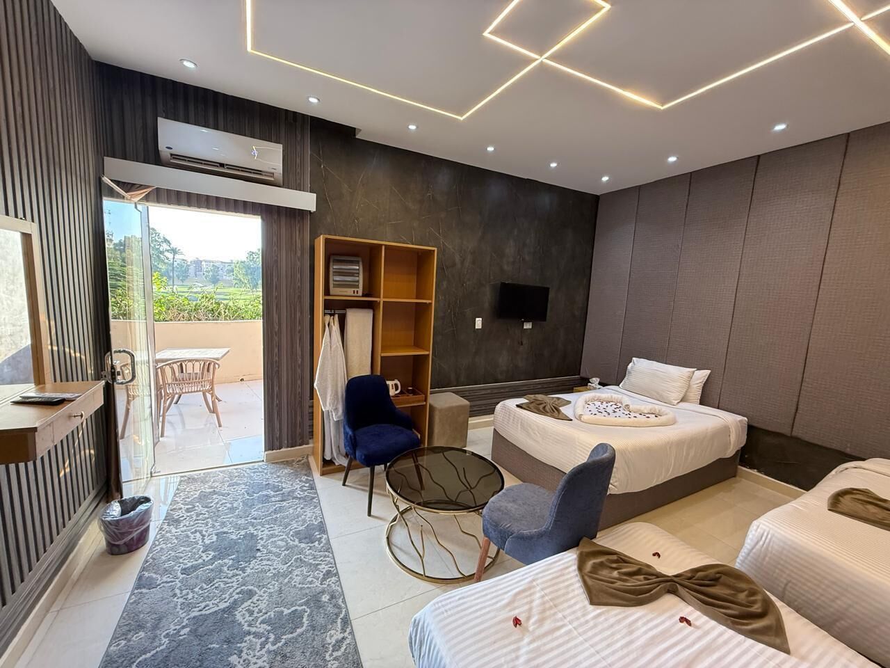 Basic Triple Room, Garden View | Premium bedding, blackout drapes, iron/ironing board, free WiFi