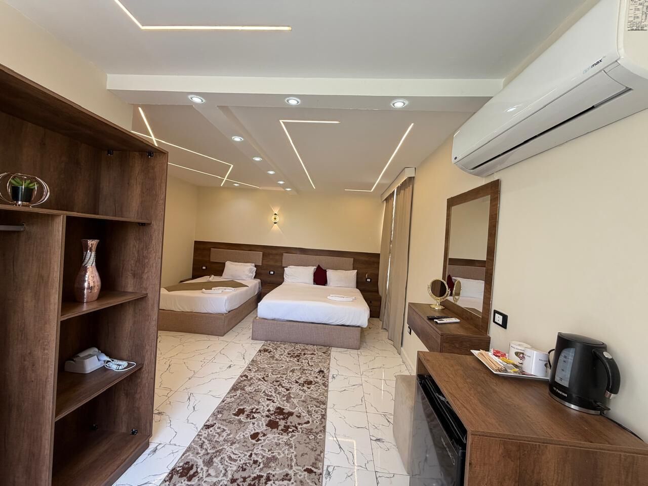 Deluxe Triple Room, Mountain View | Premium bedding, blackout drapes, iron/ironing board, free WiFi