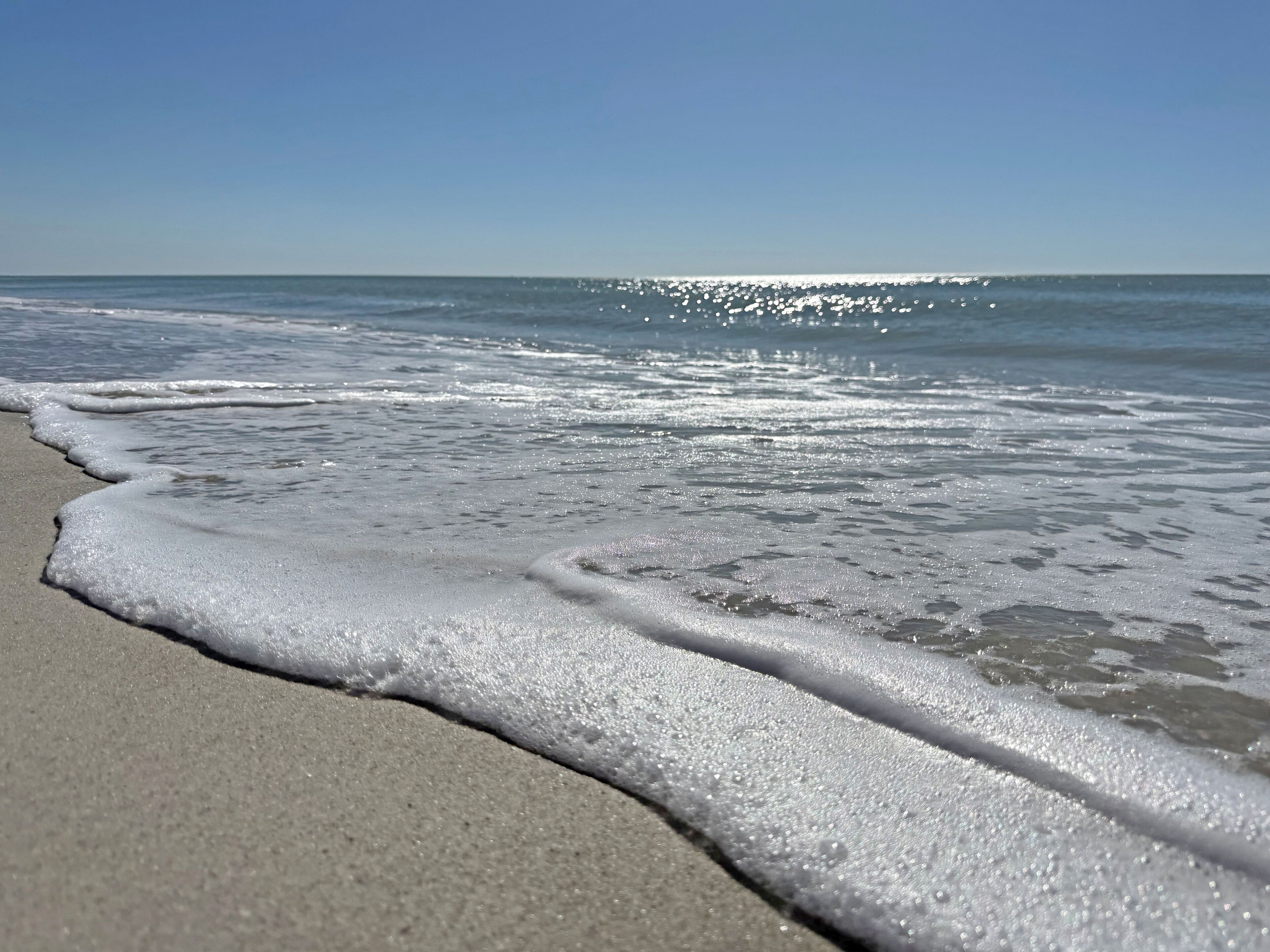 On the beach, sun loungers, beach towels
