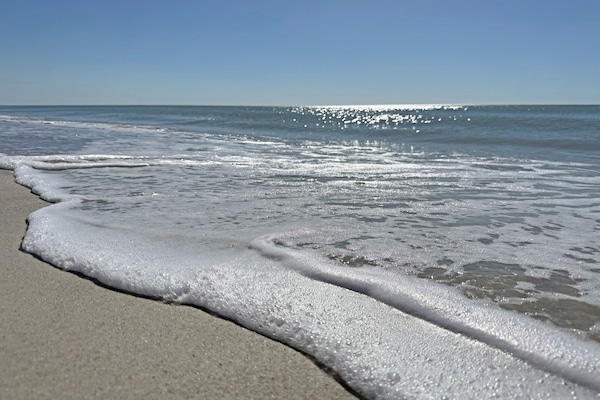 On the beach, sun-loungers, beach towels