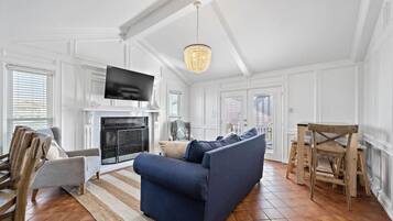 TV, fireplace, books