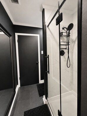 Shower, hair dryer, towels, toilet paper - Secluded. Sophisticated. Unforgettable. (Prairieville)