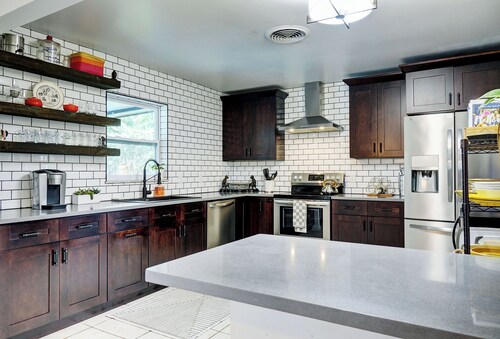 Dog-Friendly home with quick access to the beach and downtown with heated pool.