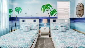 A room with two beds, a nightstand, a window with blinds, and a wall mural of palm trees and a beach. - All-new, Charming Home With Screened Pool With Spa, Game Room, & Foosball (Davenport)