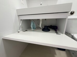 Shower, hair dryer, towels, toilet paper