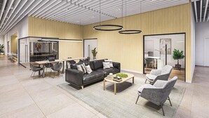A spacious, modern interior with a high ceiling, a dining area, a sofa, and a coffee table. - Luxury 1BR, Skyline Views, Penn Station (New York)