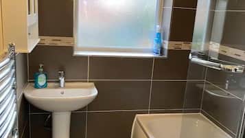 Combined shower/tub, deep soaking tub, hair dryer, towels